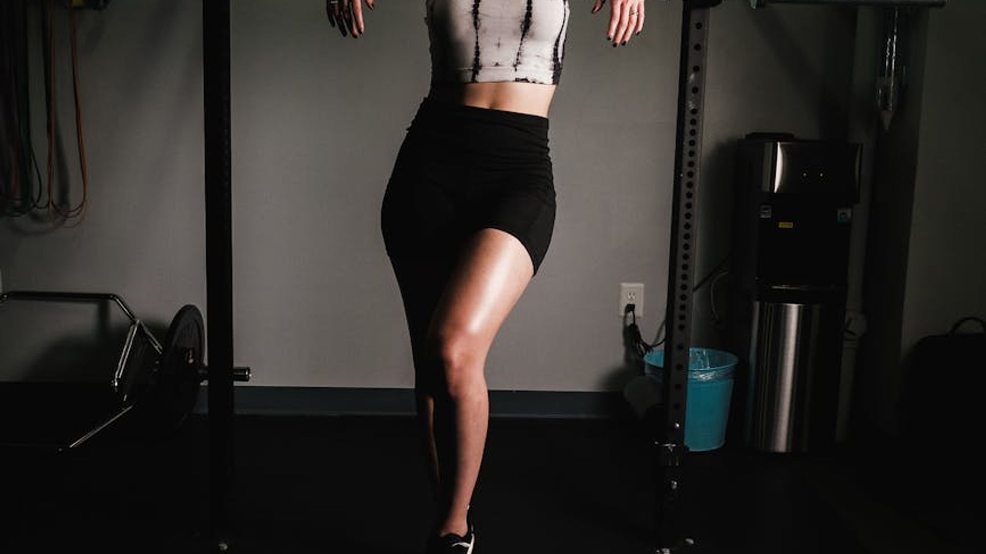 Athlete performing a strength exercise in a modern industrial gym