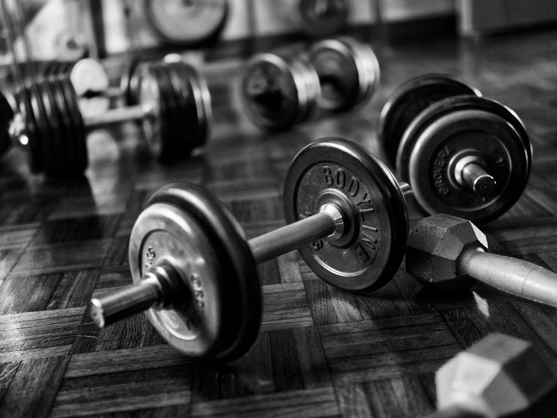 Close-up of weightlifting equipment on a gym floor