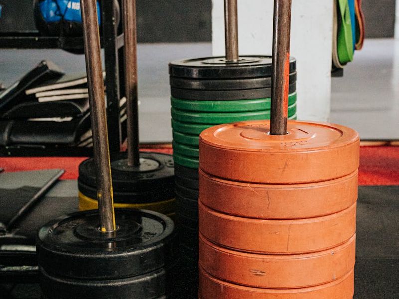 Spacious gym floor with weights and training racks